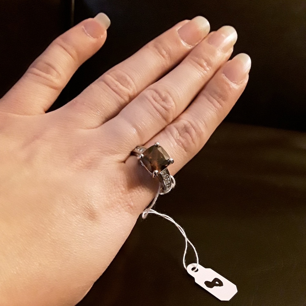 Silver ring with brown crystal